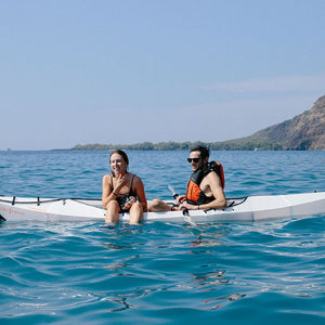man and woman in an Oru Kayak Beach LT in Hawaii