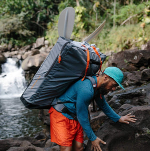 man with Oru Kayak backpack