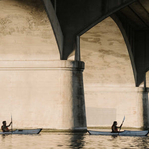 two Oru Kayak Bay ST paddling under bridge