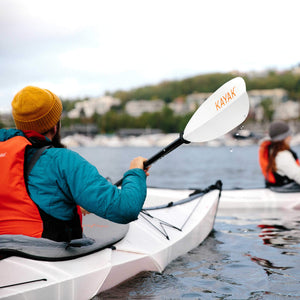 man paddling in a Bay ST with an Oru Kayak Paddle