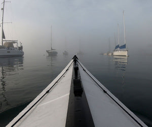 Oru Kayak Coast XT paddling through yachts