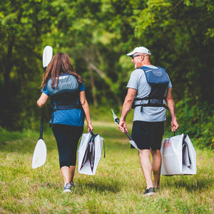 couple walking with Oru Kayak Inlets