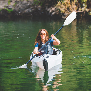 woman paddling Oru Kayak Inlet