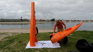 Man assembling a Pakayak Bluefin 142 kayak - Habanero