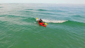 Surfing waves in a Pakayak Bluefin 142 kayak