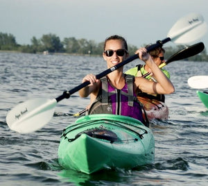 Woman paddling a Pakayak Bluefin 142 