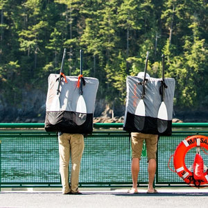 two men wearing Oru Kayak backpacks