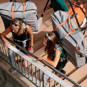 two women wearing Oru Kayak backpacks